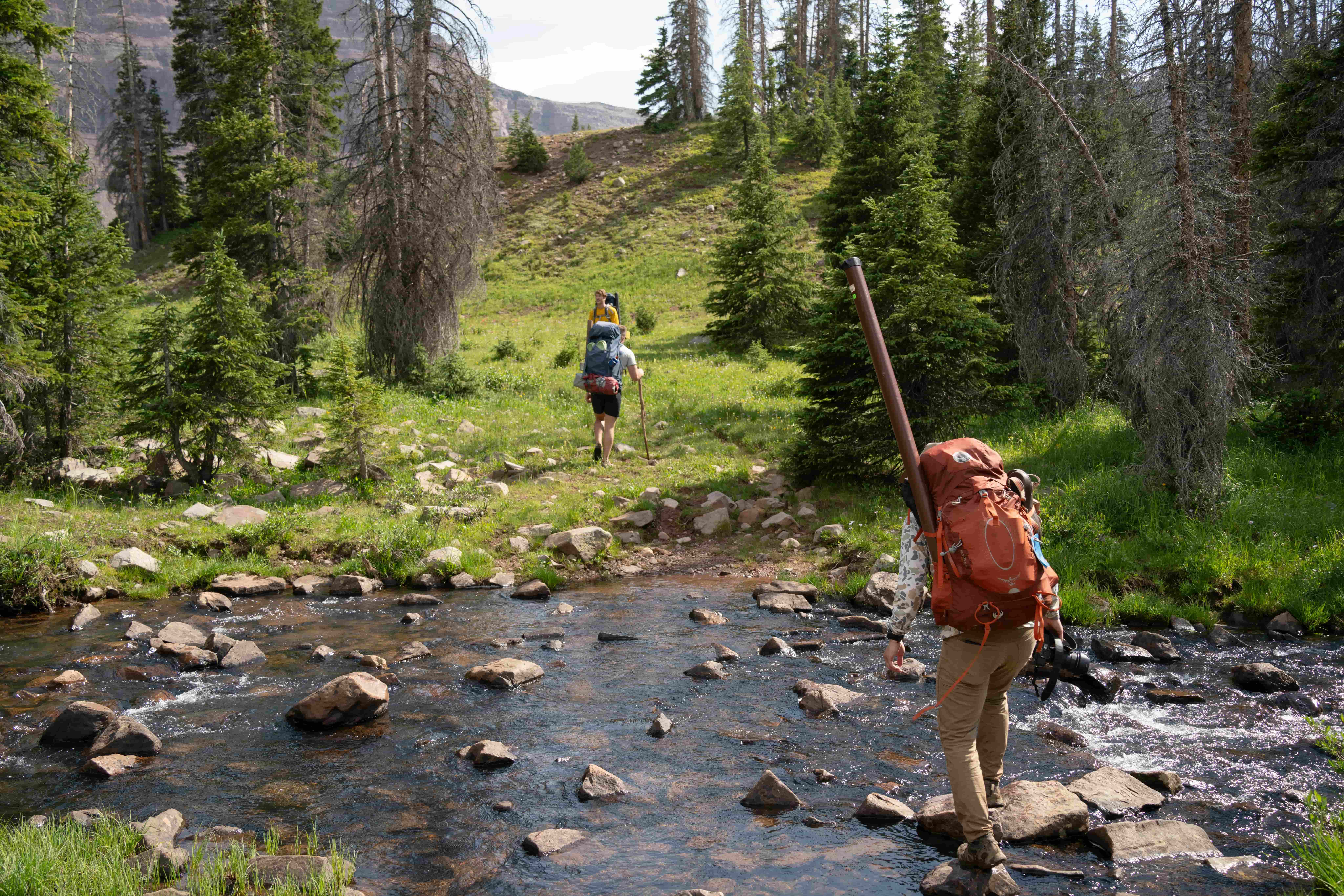 Hikers on a trail/river